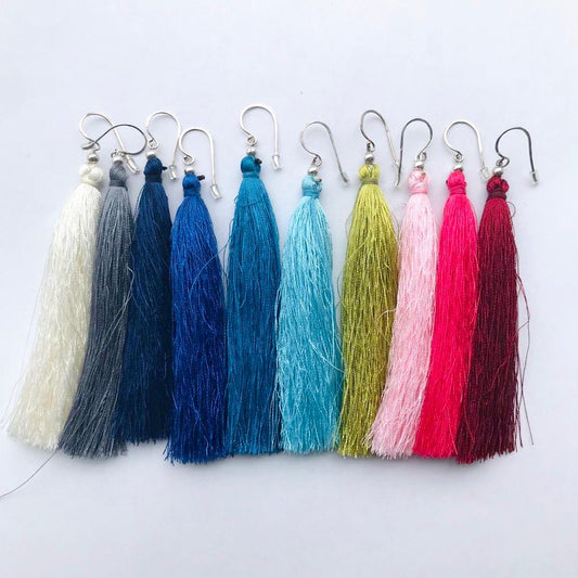 Hippakorut, vaaleanpunaiset tupsukorvakorut